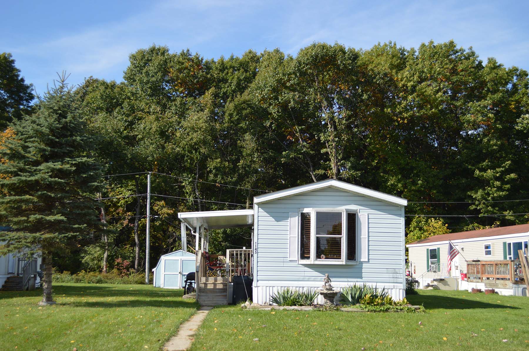 Home and spacious green lot at Lapeer Meadows