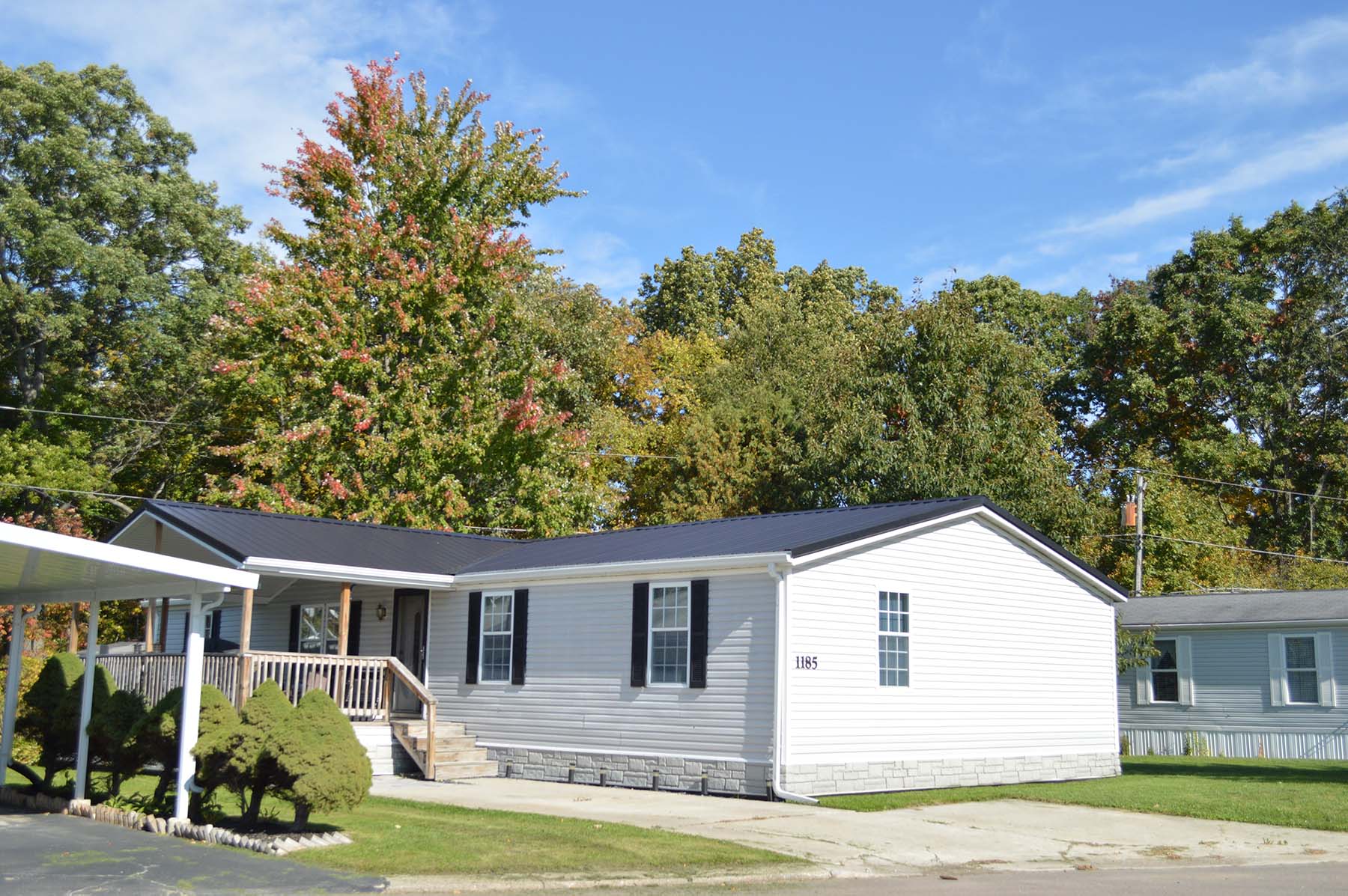 Manufactured home surrounded by trees