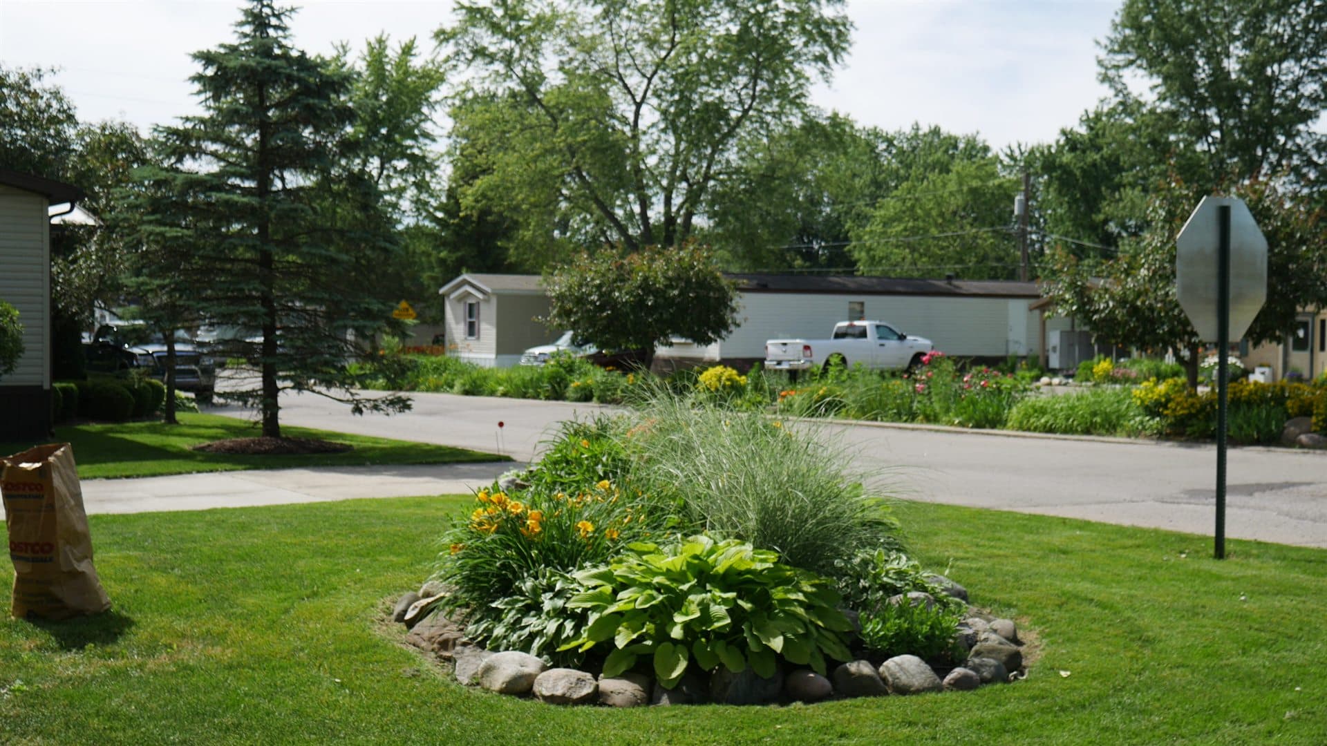 Landscaped grounds and flower island near the Lapeer Meadows entrance