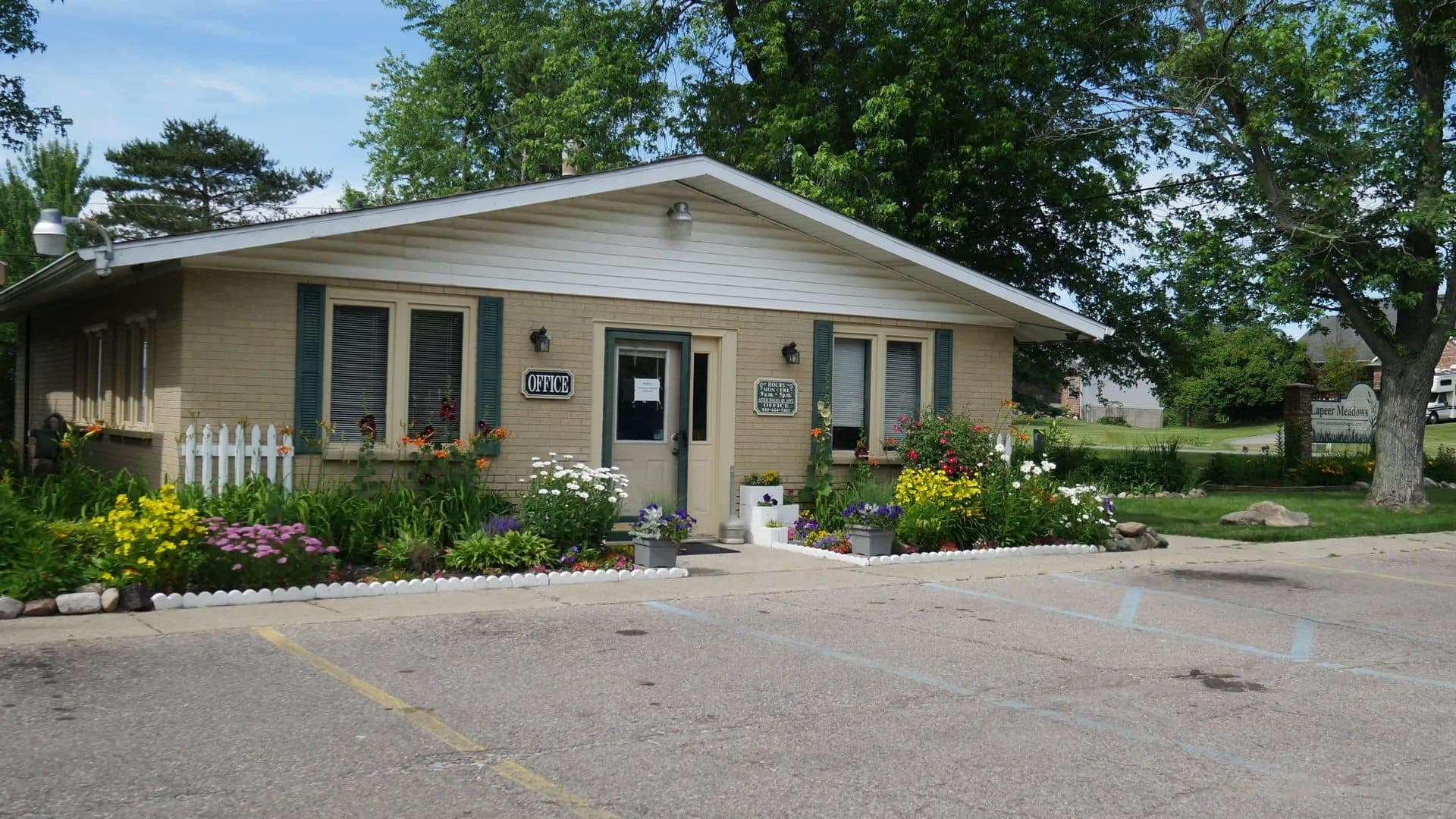 Lapeer Meadows office building with landscaped flowers