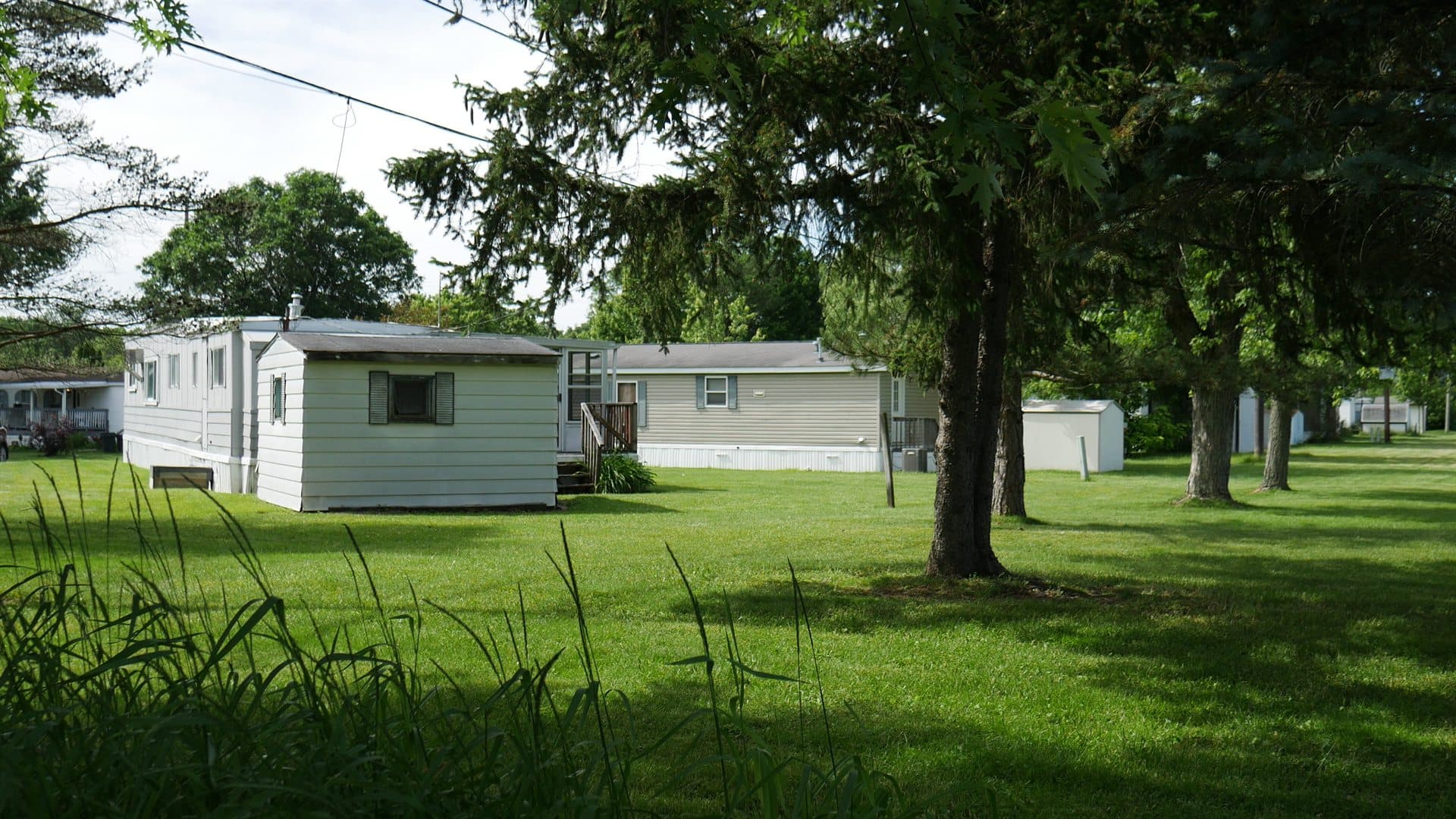 Shaded wooded home site at Lapeer Meadows
